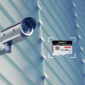 Surveillance Camera On Glass Facade